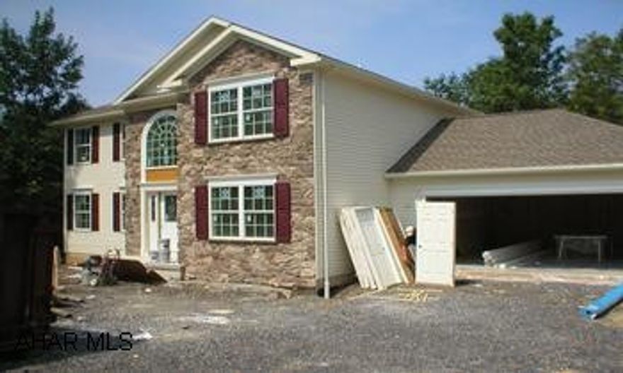 This destinctive two story home has great curb appeal with a large arch window, stone accents, and hip roof line.  Inside this home as all the right features oversized Family Room, Master bath suite with soaking tub and shower, & Open foyer.  The list keeps going.  Come see this home today!