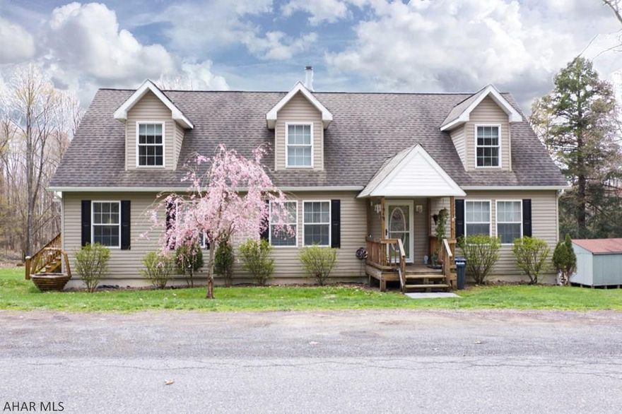 Welcome home to this charming cape cod that sits on over an acre! Featuring 3 bedrooms, 2 full baths, 1st floor master, 1st floor laundry, a wood burning fireplace, and a kitchen that is open to the dinning room, this home has so much to offer. Full unfinished basement with walk out double doors makes for an ideal storage space.  Enjoy spending time on the new, huge, wrap around covered deck! The roof covering the deck is metal and the wood was just stained this past year. Workshop/shed can also be used for storage!