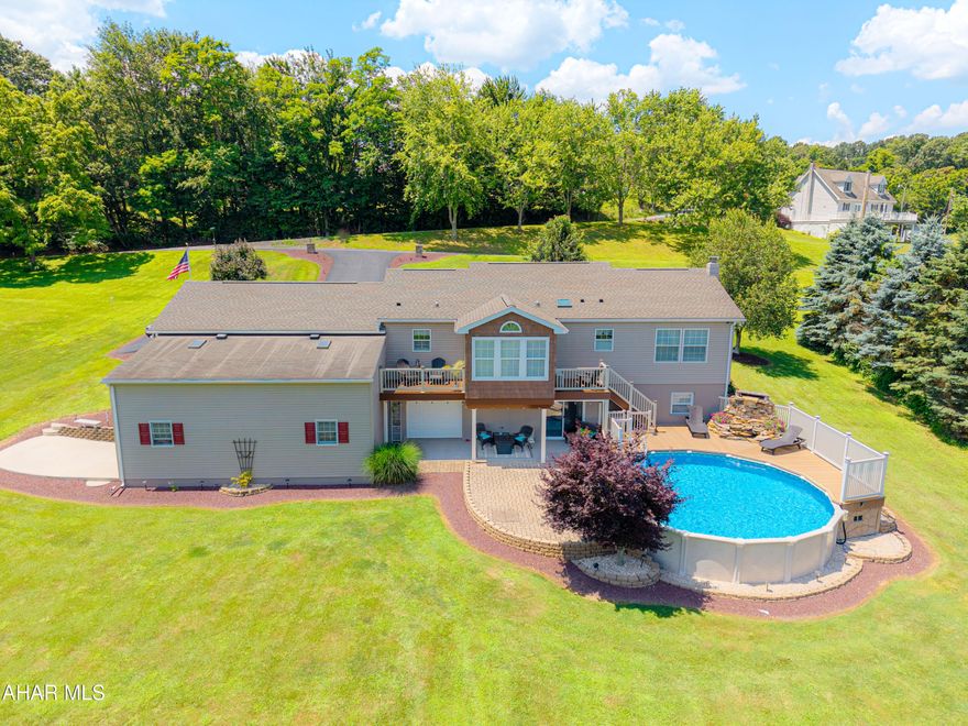 Welcome to this Home Sweet Home!  To this astounding, pristine, meticulously and well maintained to perfection home!  Move in Ready in everyway! Relaxation is offered throughout this home inside and around the property. When entering, the foyer, opens into the living and dining area then to the kitchen you just see that instant Wow!! Featuring the Luxury flooring with a nice open floor plan. Adjacent to the sunroom is the balcony to relax and enjoy the views. The eat-kitchen has oak cabinetry featuring smoked gray appliances and a pantry for additional storage, a box beam ceiling with recess lighting. The master suite has its own master bath plenty of sunlight with views of the backyard. The main bathroom is light and bright offering natural sunlight. The family/theater room has a 1/2 bath and plumb for a tub or stand up shower, 2 large TV,s, propane fireplace. Laundry room off family room and the integral garage for additional storage. The 2 car garage is temperature controlled with its impressive poxy flooring. The 30 ft RV/boat garage offers overhead storage. Step outside to the pool area offering a large stone waterfall surrounded by the timber tech decking and stone pavers and beautifully landscaped with its heart scape lighting. Visit the Large firepit and Tree house!! Fun for ALL making it your Happy Place!

Country Living at its best.  Within minutes of Shawnee State Park offering kayaking, fishing and trails.