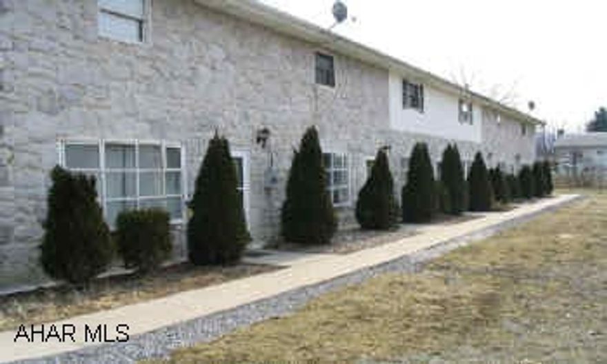 6 - 2 BEDROOM TOWNHOUSES @ $375. / MONTH. BEAUTIFUL STONE BUILDING.  PARKING FOR APPORXIMATELY 12 VEHICLES.