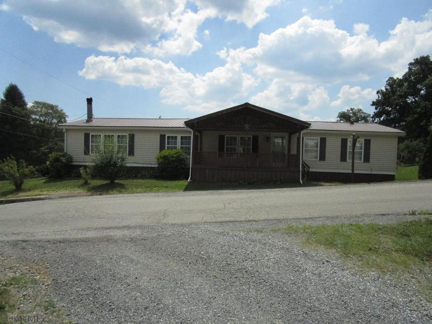 Three bedroom one level home with a two car garage. Perfect size for that family starting out or downsizing.  Master suite has a walk in closet and adjoining bath with soaking tub and shower.  Open well lit kitchen with lots of counter and cabinet space adjacent to the family room with wood fireplace.  Laundry is off the kitchen for convenience.  Oil hot air heat with central air.  Low maintenance vinyl siding and metal roof.