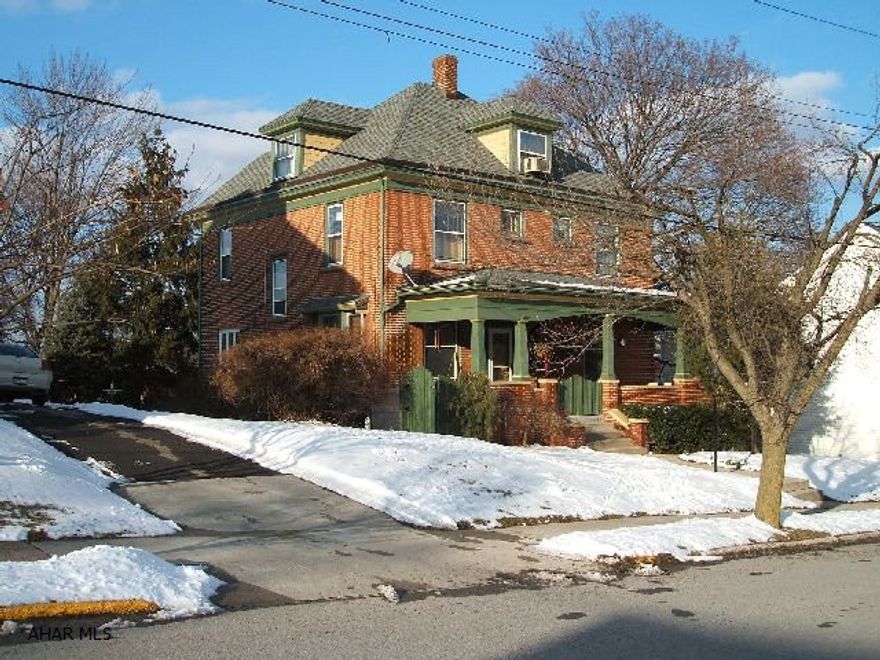 Gracious 2 1/2 story Brick Home in the Borough. 4-5 large bedrooms, 1 1/2 baths. Large welcoming entrance. Updated kitchen with Corian counter tops and cherry cabinets. Stainless appliances. Updated baths. Amazing hardwood floors and original trim. Gas fireplace. Large elegant formal dining room. Pocket Doors. Stained glass windows. New stationary gas grill on back porch. Electric dog fence. Finished 3rd floor. Basement is large, clean and dry. Walking distance to schools and downtown Hollidaysburg.