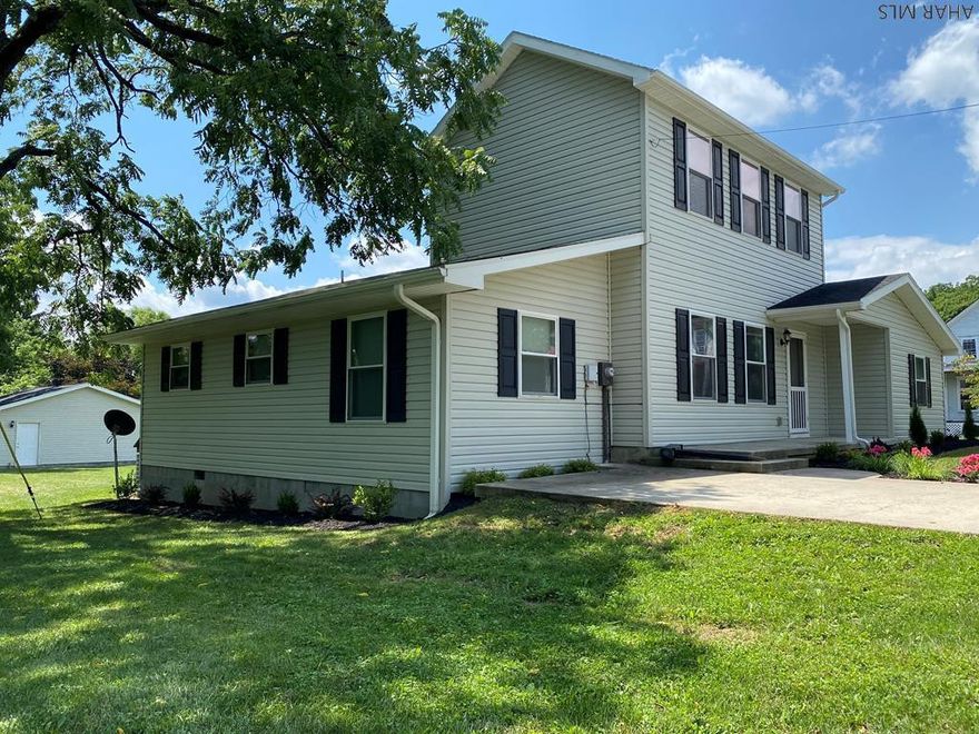 Wow, this home has it all and at a price that can't be beat!  Move in ready with so many updates, one has to see it to appreciate.   The minute you walk into this home, you will be impressed by the fabulous features like hardwood floors, ceramic tile kitchen and baths, recessed lighting, pex plumbing and so much more.  Any cook will delight in preparing meals and entertaining in the huge eat in kitchen and back deck that opens onto an incredible back yard.  3 bedrooms on the first floor enjoy the comforts of two full baths and main floor laundry room while a private owners suite on the second level has the convenience of walk in closet and full bathroom.  Combine that with a oversized 2 car garage and being within walking distance of Shawnee State Park and you have an exceptional home!