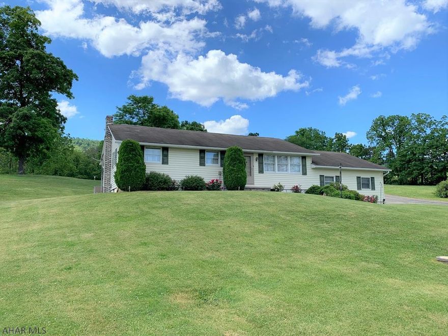 Very well maintained ranch home in Snake Spring Valley!! This home offers a living room with picture window, kitchen open to the dining area, large rear sun porch, three bedrooms, one full bath and laundry room on the main level. Full basement with half bath, updated oil hot water furnace, central air-conditioning, 200-amp electric, private well and private septic. Pull down attic stairs and floored attic for storage. Two-car attached garage, one-car detached garage with electric, outbuilding, and a fenced pasture area. Great location with large 1.85 acre lot. Enjoy the scenic country views from your own property!!!