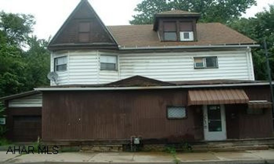 Roof 6 years / furnace 1 yr - inground pool. Good store front property - formerly a Mom & Pop store.  Very spacious and large apartment on 2nd floor.  Lot is 3.5 lots (irregular).