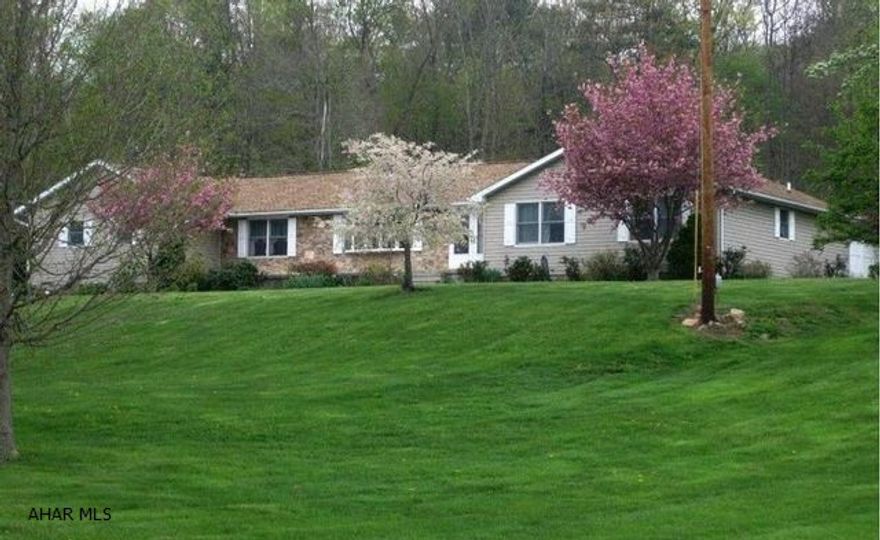 Move-in ready home just outside of Breezewood in beautiful Wells Valley, Waterfall. Forbes Road School District. Lovely rural setting on sprawling 16.45 acres. 2 living rooms, appealing kitchen ready for cooking. Spacious ensuite master bedroom. 3 total bedrooms and 2 full baths. Private in-ground pool with vinyl fencing. Screened in porch overlooking the pool for ultimate relaxation. 2 car attached garage, large outbuilding, newer mechanics including radon system. Excellent hunting on your own property!