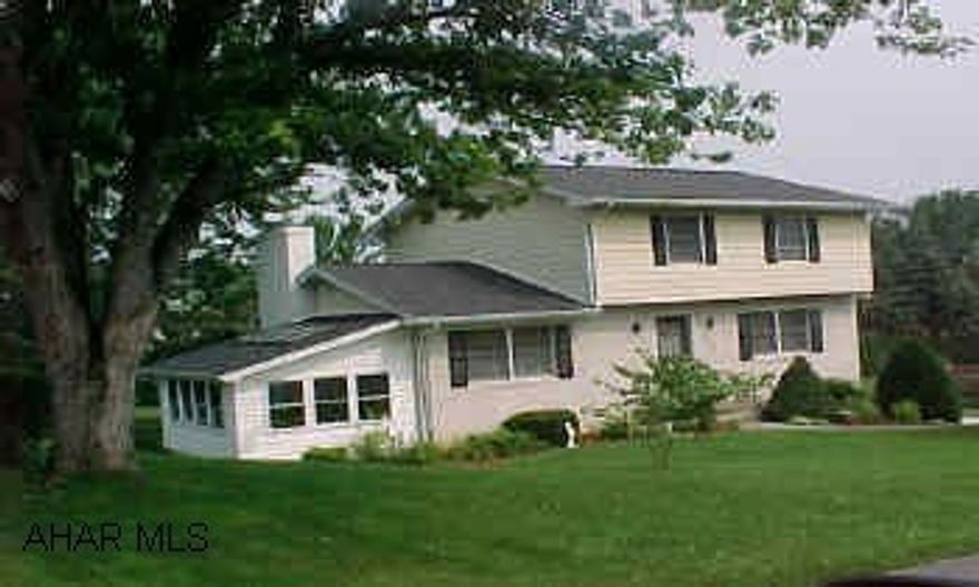 Large & spacious home with large lot, sunroom, family room w/ fireplace, lg. kitchen, FDR