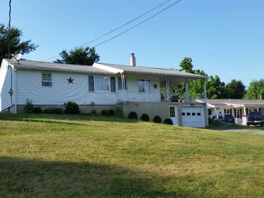 Nice home with updated kitchen & baths, open floor plan, on .662-acre lot, spacious covered concrete patio, coal/wood burner in basement, main level laundry.  J-347