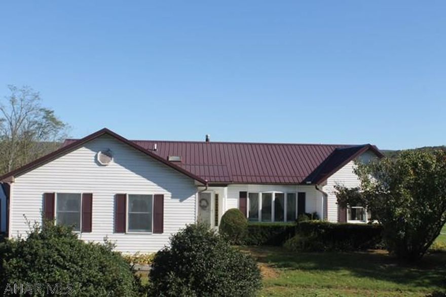 Well-maintained 3 BD 2BA 1-story ranch on 1.5 acres with an open floor plan, spetacular views, and natural light throughout.  Practical and desirable main floor living in a country setting conveniently located.  Features include newer roof, Anderson windows, sun room, skylights, ceiling fans, large covered porch, wood paneled two-car garage plus a detached single car garage, energy-efficient heat pump. Basement partially finished boasts a high ceiling with many options to suit your needs.  Move-in ready.