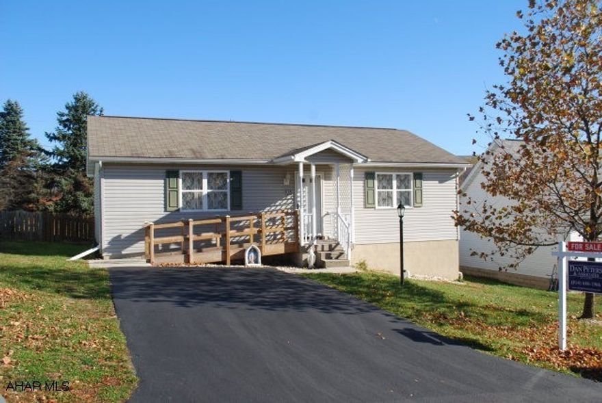 Built in 1994, beautiful one story home with spacious living room, nice dining area with French doors leading to rear deck, kitchen includes stove and refrigerator, two bedrooms, one bath, first floor laundry room, large full basement, central air, fenced in yard with covered deck, underground utilities, and new front entry ramp.  Great neighborhood!