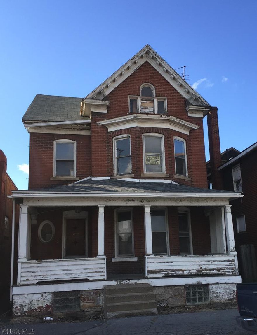 Project for a handyman/investor! Needs lots of work, but great architecture, solid brick Victorian. Huge 26' by 36' (936 sq') garage. AS IS. CASH ONLY.