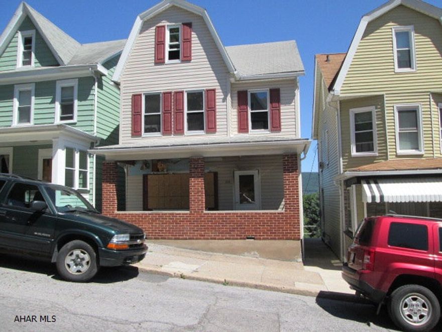 House features a spacious eat-in kitchen and first floor laundry.  Newer vinyl siding and windows.  Nice 14X23 deck with a great view! Needs some TLC.  Being sold AS-IS. Seller will make no repairs.  Would make a great investment property!