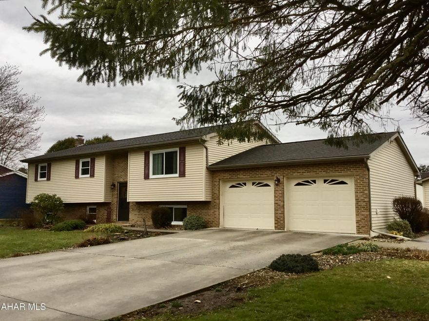 Don't miss this updated 3-5 bedroom, 3 full baths Split Entry home conveniently located in a lovely neighborhood with a fantastic mountainous view. The open floor plan, year round naturally lit family/sun room grace the main floor. The lower level currently serves as an in-law suite with a full kitchen, living/dining, 2 bedrooms and a full kitchen. The lower level has easy access from the garage as well as interior access. The forced air propane heating system is backed up by electric baseboard heating as well as a wood burning stove in the lower level. This property also features a 2 car garage and 2 sheds, driveway parking large enough for 4 cars.