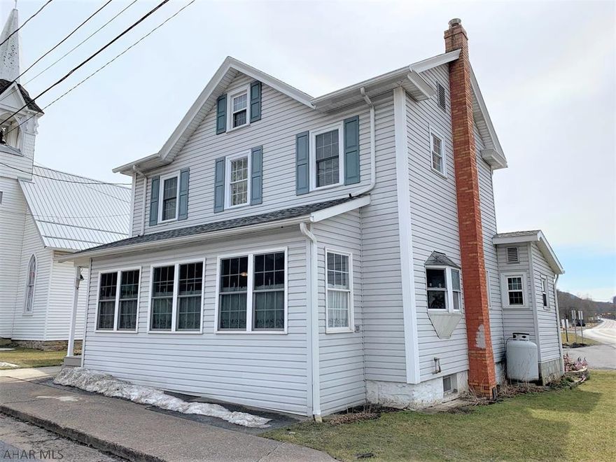 This home has had extensive renovations and updated inside and out!! Main level offers an enclosed sun porch, living room, 1/2 bath, family room w/ fireplace, kitchen w/ hickory cabinets & pantry, light & airy sitting room, master bedroom, master bath w/ laundry. Second level has two bedrooms, another full bath and a den/office. Ductless heat pumps w/ central air, oil boiler, and electric BB heat. Large three-car garage w/ walk-up attic storage and small workshop. Blacktop driveway for off-street parking and a storage shed.  This is a roomy home that had been nicely updated and well cared for!!