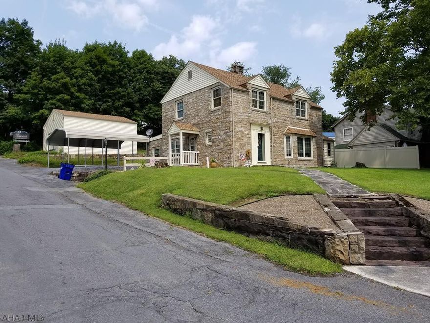 Immaculate stone home on quiet street. This home is loaded with features such as hardwood floors, marble window sills, stone fireplaces, remodeled kitchen w/stainless appliances and counter tops, large living room with new Harrmon pellet stove, enclosed side porch  (great bonus room), new floor coverings throughout the house, beautiful dining room featuring built-in cabinets.This amazing home also features a beautiful STONE exterior, large detached garage and beautiful landscaping. We have just touched on a few of the many features this home offers! This home it truly worth a look...