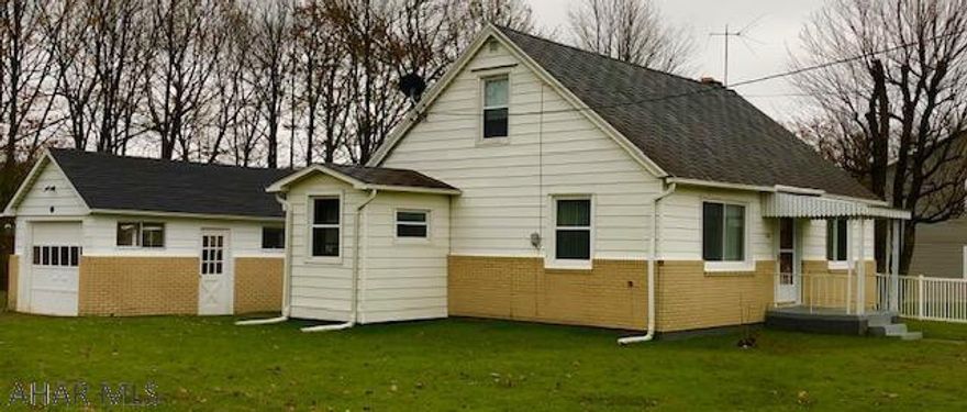 Lovely 2 bedroom home with all new windows and new roof and many updates throughout the home including new carpet.  This home features a large LR, Formal DR and a large basement that could be finished.  A extra large detached garage is a plus.