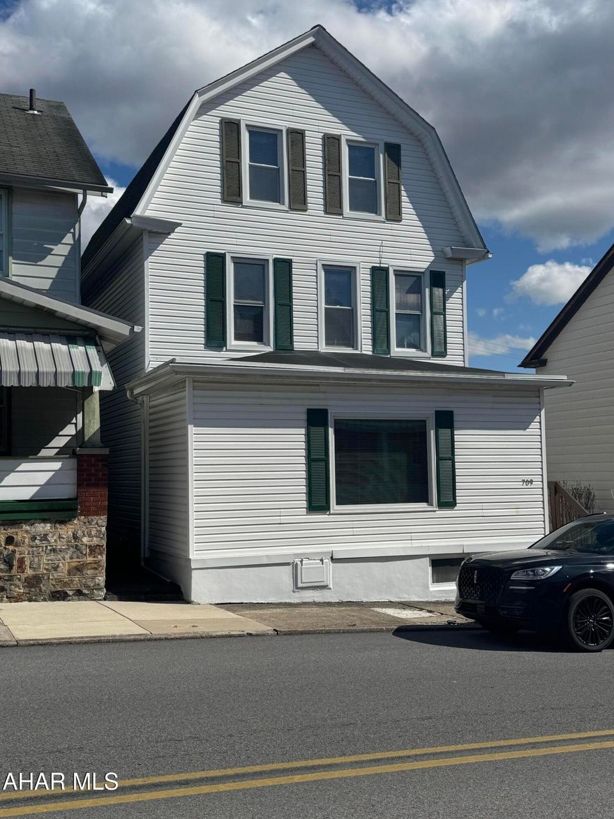 Walk into this very warm and welcoming home with lots of space! Enjoy family time in the large living room with a gas fireplace. Display grandmas vintage dishes in the built in cabinetry in the dining room. Second floor has a full bath and 3 bedrooms along with a sewing/ironing room. Need extra space? Dont worry! Step into the finished attic that comes fully furnished! Enjoy the outside in the enclosed porch area and views of the city!  Call listing agent to tour today!