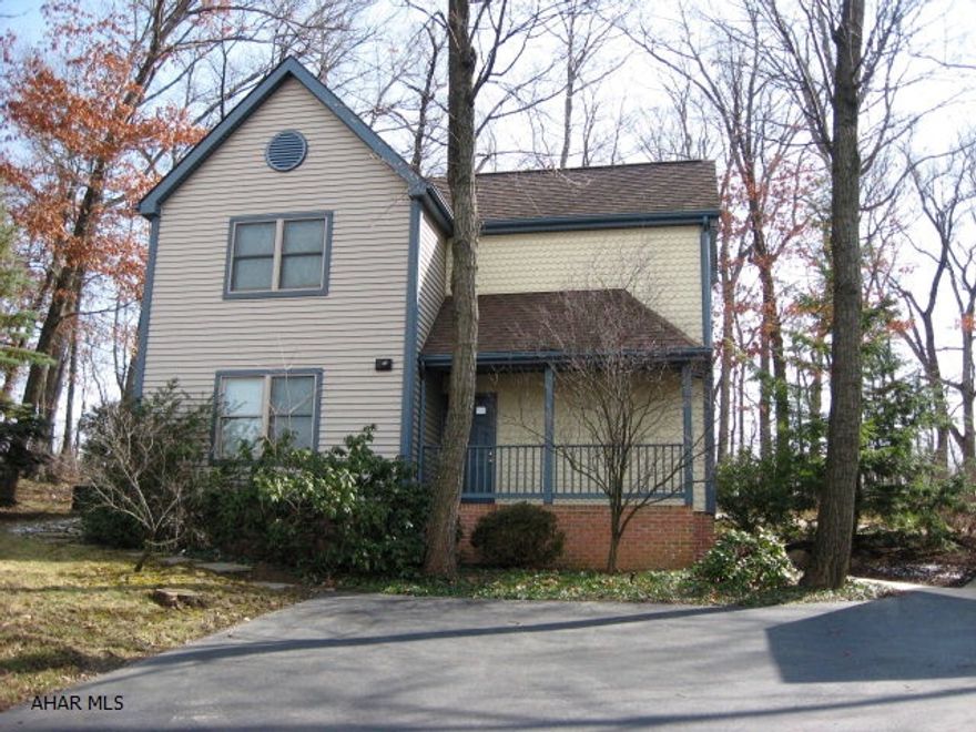 Contemporary home nestled on a private wooded lot. New corian counters. Interior newly painted. 4 zone heating. Detached garage 15x25 with storage loft. Concrete patio.