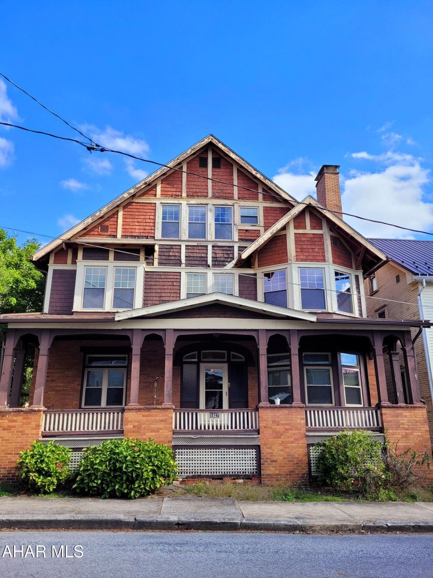 Charm? Check. Original wooden trim and moldings? Check. Stained glass windows? Check. Gorgeous hardwood floors? Check! You absolutely need to come see and appreciate this incredible house. Step back in time with the original finishings and charm, such as wooden pocket doors, that have been lovingly maintained in this home. If you are looking for space you have found it! 6 bedrooms, two bonus rooms, a large dry basement with a half bath, and 3 full baths, all on 4 city lots, means you have all the space you could want! There is also off-street parking under a carport and a small 1 car garage for convenience. This home is just too beautiful to pass by- it's waiting for your personal touch!