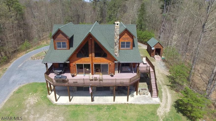 This sophisticated & luxurious post & beam retreat reflects the magical merging of inspiration & architecture with this 3 bedroom, 5 bath masterpiece. Sprawling entertaining spaces flow seamlessly from living and dining areas to the porches and terraces that capture the true essence of the Alleghany Mountains. Main floor master suite plus 2 master suites on 2nd floor include walk in closets A lower level guest retreat with 2 bedrooms, bathroom and family room flanked by a wall of windows will impress even the most discriminating buyer. 5 car garage, gorgeous private pond that looks more like a lake, hiking and all terrain vehicle trails plus great hunting and fishing make this the perfect retreat..conveniently located within minutes of LaVale, MD and close to Historic Bedford, PA