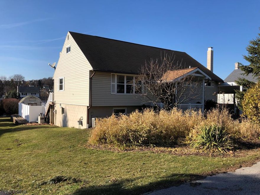 This move in ready home is nestled in the popular Pleasant Valley area. So many HANDCRAFTED updates to enjoy! The front door is custom made with handcrafted stained glass windows. In the spacious living room is a built-in entertainment center crafted by the Amish. The first floor bath is completely updated. The huge attic is finished with a bedroom and a half bath and finished bonus room that could easily be turned into another bedroom! The walkout basement includes a custom made bar and wood burner with a hearth. The outside boasts off street parking, a covered composite deck, in-ground pool, fruit bearing trees, patio, shed and an incredible view!! And a MUST SEE KITCHEN!! designed for beauty and functionality, it spares no expense! Soft close drawers, granite and lots of space!