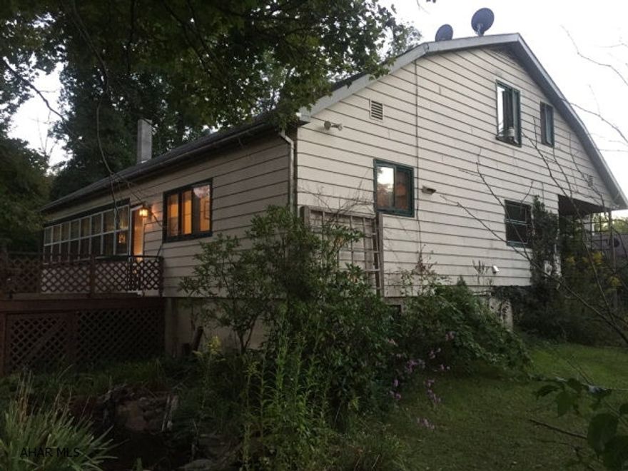 Beautiful cottage with 3 bedrooms and 1.5 bath on 0.69 ac bordering Dunnings Creek. Property has a one car integral garage, enclosed sun porch and large wrap around porch. Some furnishings will convey.