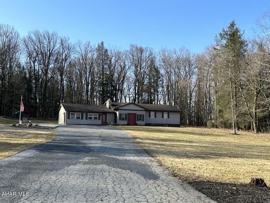 Ranch home on 1.5 acre lot, 3 bedrooms and 1 bath on the main floor, enclosed front porch, huge living area with propane fireplace perfect for entertaining, finished basement with wood stove, family room, 2 bedrooms, full bath and laundry room, concrete and paved driveway, private back yard with new deck, 2 sheds, rear foundation wall of house has been replaced, lot has been surveyed