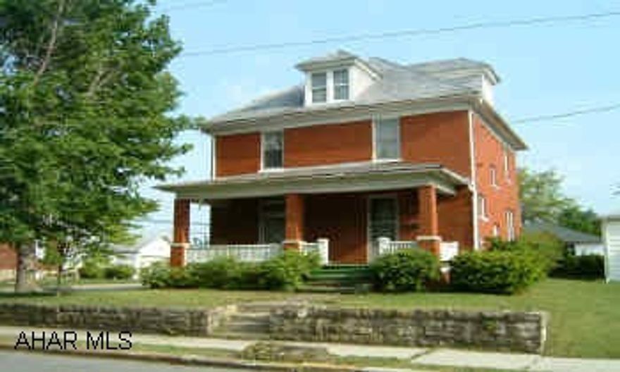 Solid brick home on corner lot  in great residential neighborhood in Roaring Spring.  Needs some TLC. Lovely stained glass windows in livingroom. Large detatched 2 car garage.  Porches, patio and sidewalks all in need of repair.  Solid brick home on corner lot in great neighborhood in Roaring Spring.  4 rooms on 1st floor and 4 rooms on 2nd with 1 full bath.  4th room on second is small.  Home needs  TLC.  Is being sold "as is".  Large detatched 2 car garage.   Lovely stained glass windows in livingroom with original wood trim.  Great potential for a buyer to restore this home to its original condition.
