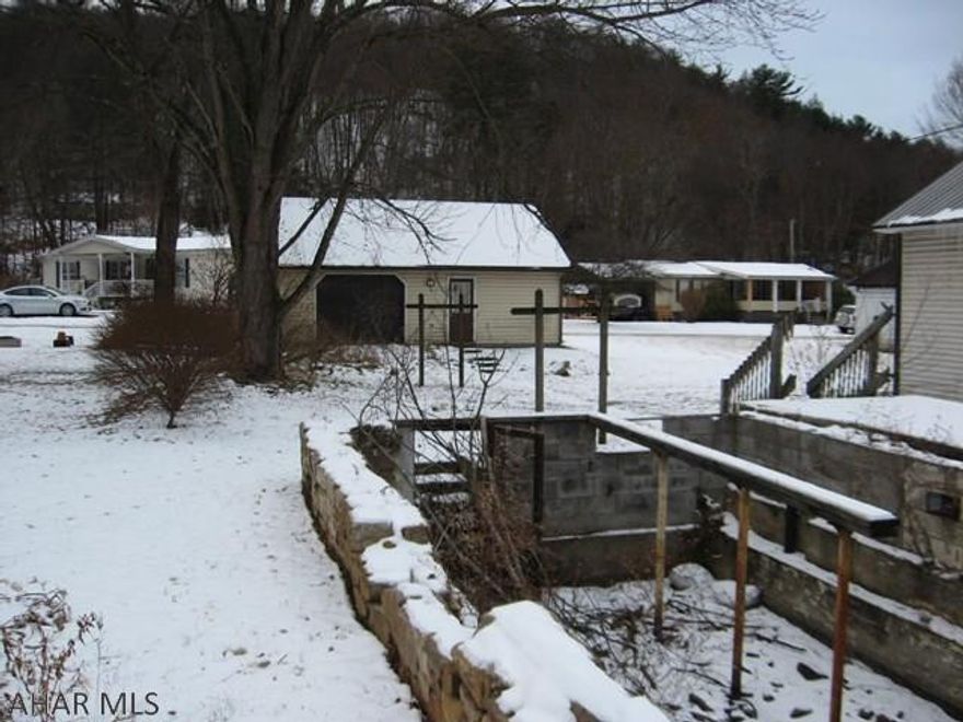 Many possibilities with this lot located in Coaldale Borough that includes:  a two car garage, rear access, public water and sewage already in place - just pay costs to hook in to the systems.  There is an open foundation on the property from a home that had previously burned down so please use caution when touring this property with an agent.  All showings of the garage must be accompanied by the Seller.