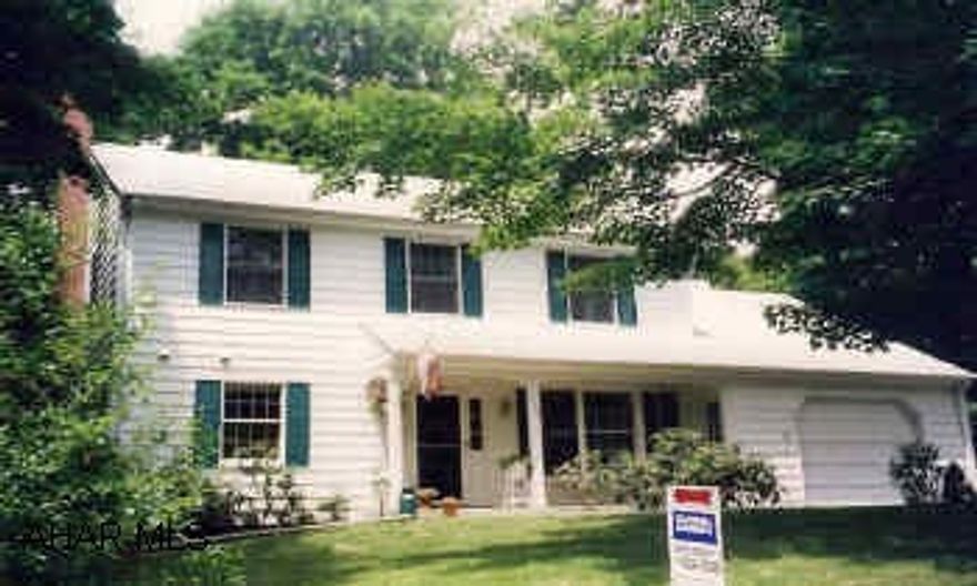 Traditional 2-story home located in nice neighborhood. Foyer w/slate tile, family room w/fireplace & brick hearth. Decorator touches; interior solid wood dors, oak stairway; carpeting, hardwood and ceramic tile; attice storage. Large private deck in back with woodland views, tiered gardens landscaping, brick walkway, stone wall & perennials.