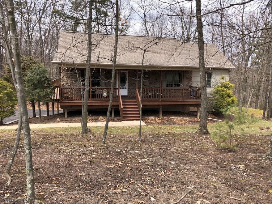 Enjoy this well kept ranch home in Lakeland Pines! Lakeland Pines is a well sought after neighborhood due to its close proximity to Lake Raystown, Seven Points Marina, & the Allegrippis Bike Trail. At Lakeland Pines you can enjoy the neighborhood trails, the catch & release pond, gazebo & much more. Two of the 3 bedrooms in this adorable ranch home have sliding doors that lead right on to the 16' X 24'4 deck to catch the beautiful views of the wooded back yard. With an eye catching stone fireplace and great views this home is a must have! Along with the finished basement and integral garage, this ranch also has a spacious workshop measuring 18'X12'. The master bedroom has a nice size walk in closet and master bath with a separate jacuzzi.