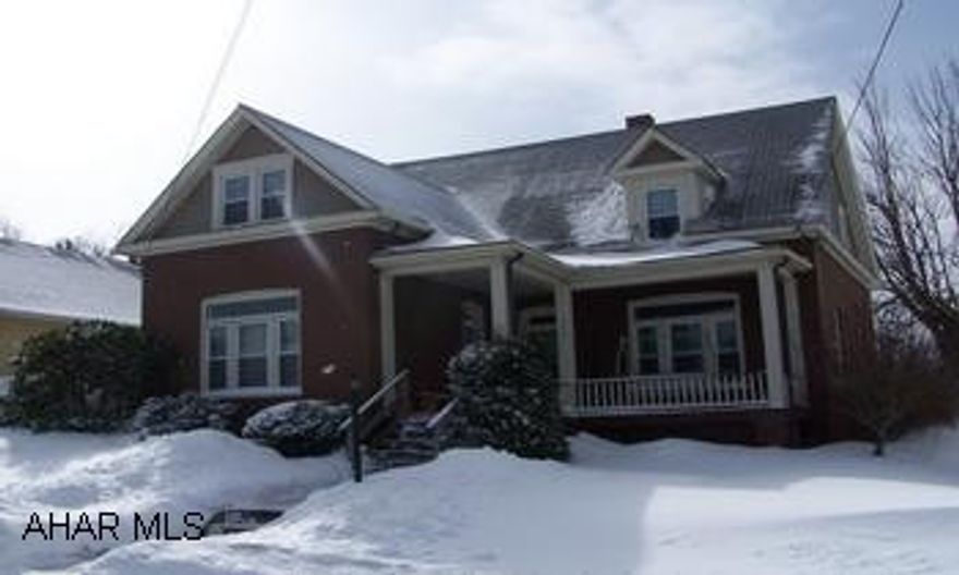 2 story brick  3 bedrooms, 1.75 baths; deck + screened in porch Fenced in yard, lovoely wookwork, open stair case pocket doors