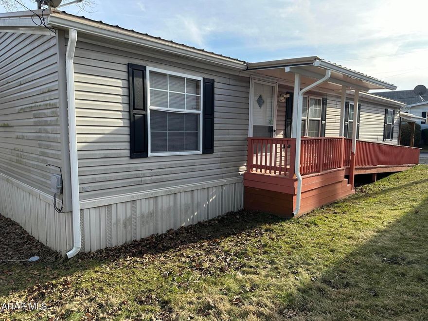 Updated and close to everything is what you will find with this conveniently located double wide in the Greenwood area of Altoona! Spacious Updated eat-in  kitchen with plenty of cabinet space, Both a living room and family room, primary bedroom with a large spacious  bath and a walk in closet. Two additional bedrooms and an additional bath in this spacious home. New metal roof in 2019. Lot rent $340/month includes water/sewer & lawn maintenance.
