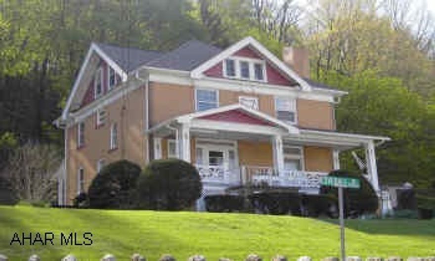 Well kept home in borough-wonderful views... 2 porches-private road, maintenance agreement-finished attic.