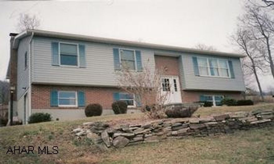 Nice Brick/Vinyl Raised Ranch on one acre. Country living but minutes from town. Peaceful setting. Well-insulated home by S&A. Above ground pool, appliances included. Woodburner at lower level.