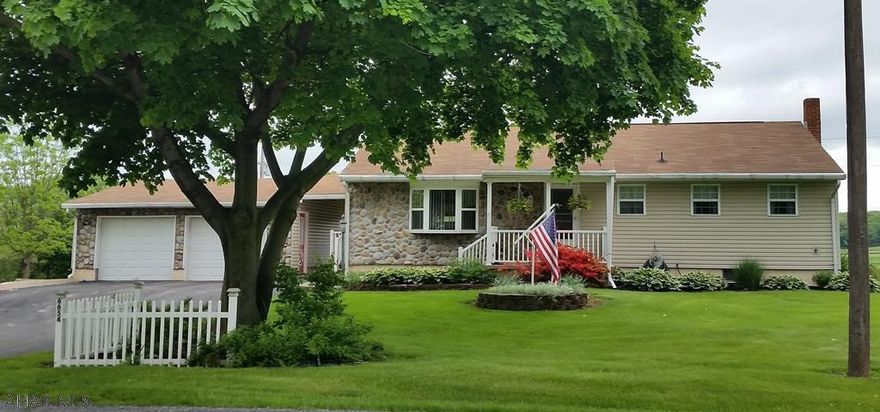 Vinyl-sided 3-bedroom home w/ nice hardwood floors, family room, newer oil furnace + rice coal stoker, updated kitchen w/ granite counters & oak cupboards, 2 decorative fireplaces, covered patio, 2-car 28x30' garage plus 15x16 detached shed on over 1/2 acre. Survey in other docs (.7 Ac includes .12R/W along  Rt 36)  J-429