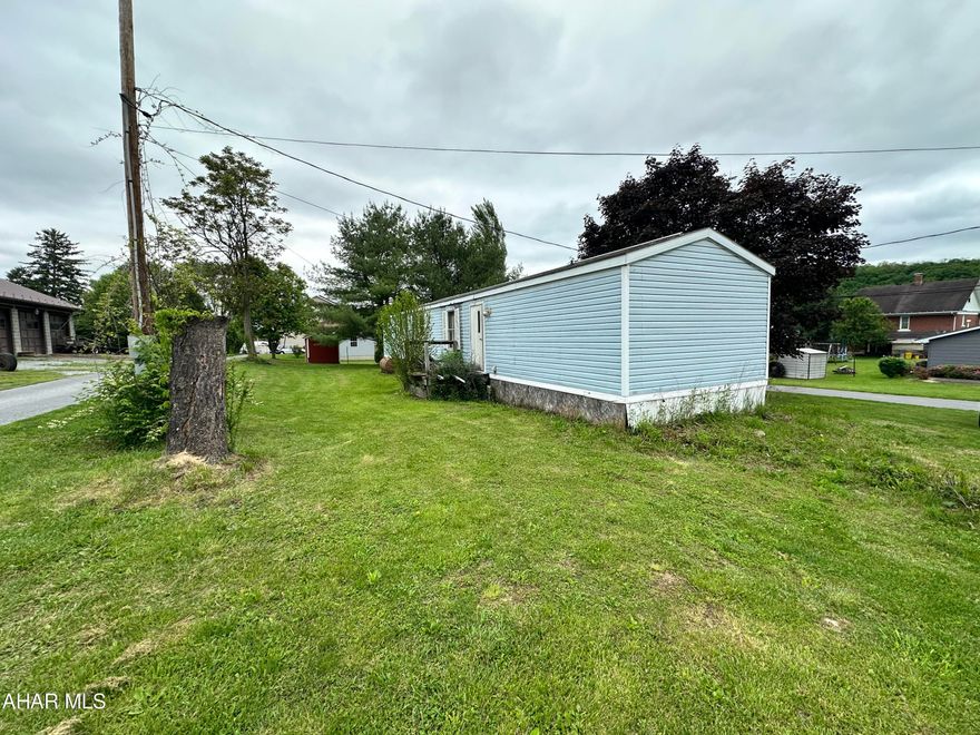 Singlewide manufactured home with 2 bedrooms could be 3 again, previous owner opened up a wall to make a larger bedroom. This home needs TLC but could be a good property for a rental or flip or even someone who likes a project. The property is on 2 parcels both 60x75, one lot is known as Waid Alley. Sold AS-IS Estate will make no repairs. Motivated Seller!