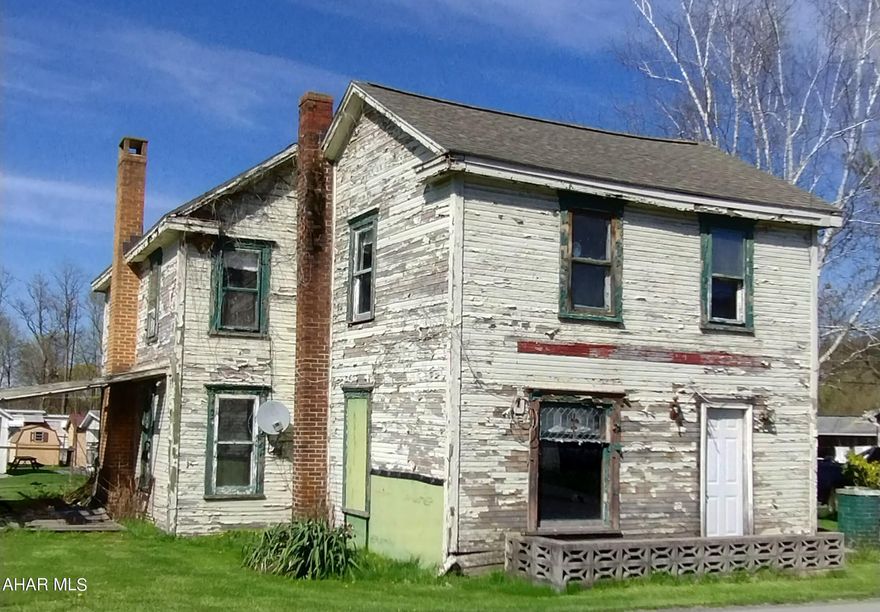 Handyman Special !  Spring Cove School Dist.... 3 bedroom 2 bath home gutted down to the studs..living room and dining room has hardwood floors. foyer has original stair case and hardwood flr ..Kitchen has fireplace...closed in back porch for laundry room ...   new roof put on in 2012 ....Make this house your next home ...Listed for $55,000