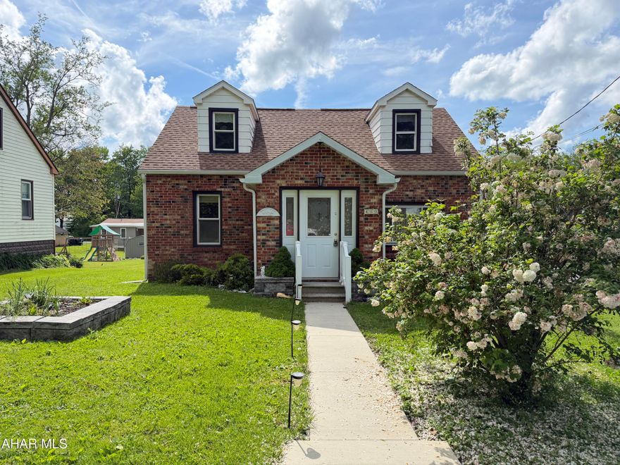 Welcome home to this charming Cape Cod style house! It sits on a beautiful corner lot in a low traffic area and is ready for you to move right in.  The spacious living room has large windows allowing natural light to flow in. The living room dining area make it the ideal space for entertaining family and friends.  The kitchen has plenty of cabinets for storage and features a large counter top for meal prep that doubles as an eating area.  All the appliances are included. There is a first floor bedroom and a full bath that complete this floor.  Upstairs, you will find two spacious bedrooms with newer flooring and plenty of closet space. The basement has an upgrade to the Pittsburgh toilet with a 3/4 bath and a laundry area.  Outside you will find a large deck to enjoy in the summer and a garage for covered parking in the winter. With a newer roof offering peace of mind, call today to see what this great home has to offer!