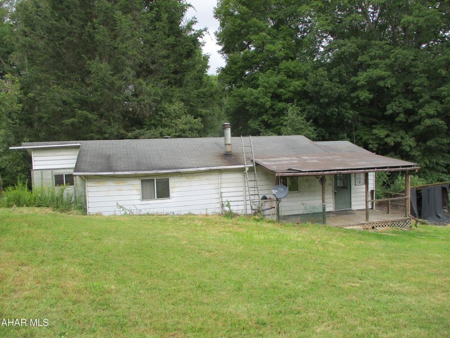 Looking to own some acreage with a possible camp? This could be just for you. 9.5 acres of mostly wooded land with apple trees in the yard. 2 car detached garage. Mobile home with additions. Large living room with coal stove, eat in kitchen, full bath, laundry room, one large bedroom and a smaller bedroom/office. Propane forced air heat or coal stove for versatility in the winter.This could be a residence or a great camp. Please note, when driving back to the property, it is advisable to drive vehicles with ground clearance.