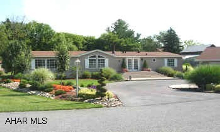 BEAUTIFULLY LANDSCAPED ONE STORY DOUBLE WIDE WITH 2 CAR GARAGE, 3 BEDROOMS, TWO BATHS. IMMACULATE. LOCATED ON DOUBLE LOT. LOT RENT IS $330 PER MONTH INCLUDES WATER/SEWER, TRASH & SNOW REMOVAL.  BEAUTIFULLY LANDSCAPED ONE STORY DOUBLE WIDE WITH GARAGE AND BONUS ROOM, 3 BEDROOMS, TWO BATHS. IMMACULATE. LOCATED ON DOUBLE LOT. LOT RENT IS $330 PER MONTH INCLUDES WATER/SEWER, TRASH & SNOW REMOVAL.