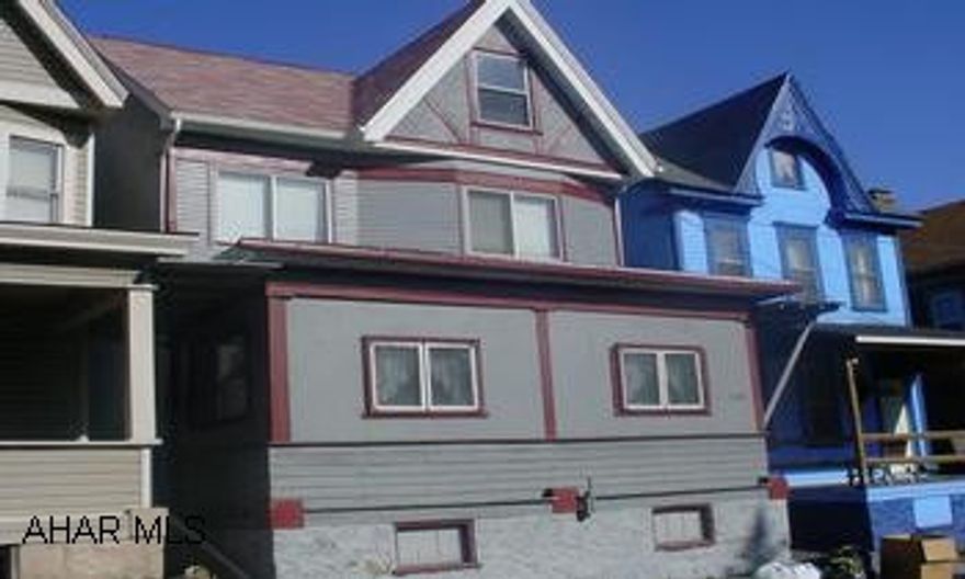 Sweet house with sunporch, breakfast nook and modernized kitchen and bath.  Covered rear patio and off-street parking.  Attic could easily be another bedroom.