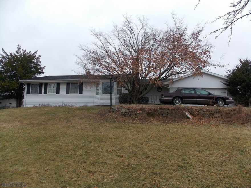 One story living in Riggles Gap!! Spacious living room with plenty of natural light. First floor family room walks out to an outdoor patio. Master bedroom has a 3/4 bath. Finished lower level is great for entertaining. A detached and attached garage offers tons of storage. Inground swimming pool and a great yard. Such a peaceful and private property that sits on 5.97 Acres. Property does need some TLC, but has great potential! All of this located in the Bellwood School District!