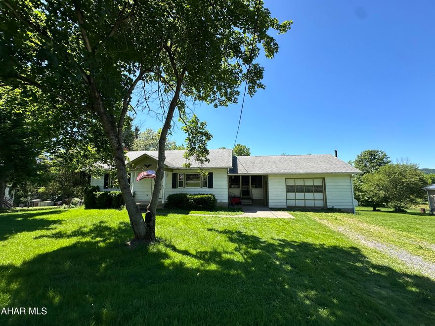 2.4 acres with ranch home in Hollidaysburg, 2 bedrooms, 1 full bath on main floor, basement opens to ground level in the back of the house, basement has one finished room and a 3/4 bath, breezeway, solid concrete block home