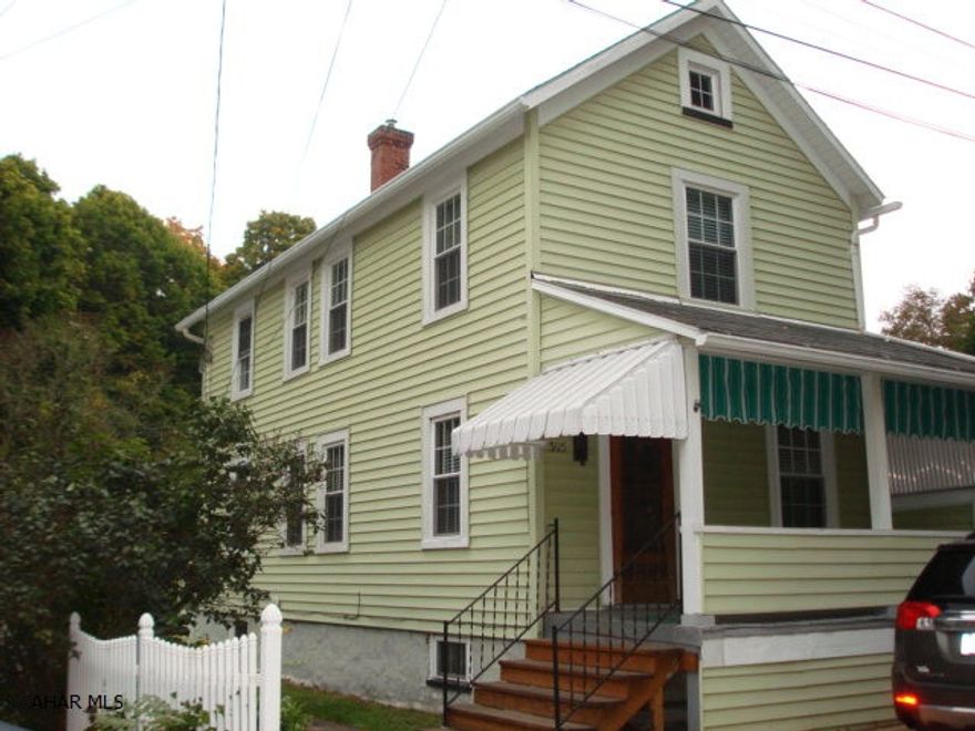 Very nice starter home or investment property, move-in ready.  This property boasts central air, thermo-pane windows, hardwood floors, backyard, carport and vinyl siding.  Attractive pavers at the front and side walkway, adds an extra parking space.  Bonus room could be used in many different ways.