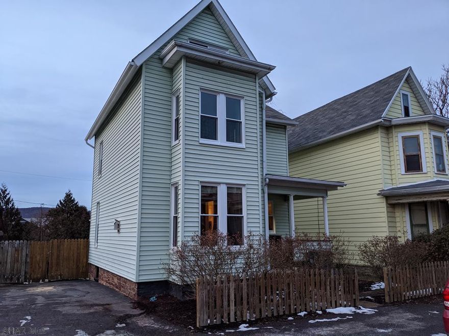 Tastefully Remodeled, Spacious Home on Large Lot. 4 BR 1.5 Bath Home with Formal Dining Room, Living Room with Fireplace, and Kitchen. Half Bath with First Floor Laundry and Large Mud Room Round Out the First Floor. Second Floor has 3 BR and Full Bath with Beach Theme. Third Floor is a BR and a Large Storage Room. Freshly Painted with New Carpet Throughout, New Windows, New Boiler. Move In Ready. Fenced Back Yard with Picnic Pavillon Provides a Private Spot for Outside Activities and Entertaining. Off Street Parking. Includes All Kitchen Appliances.