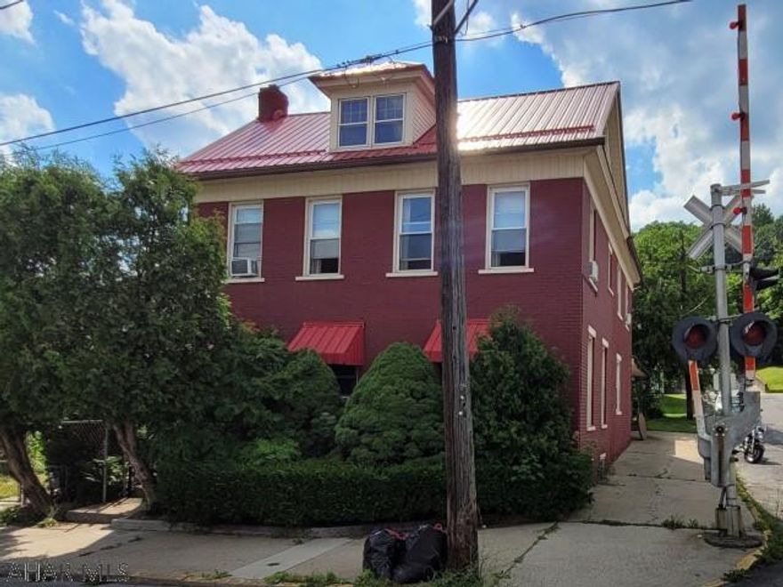 2 1/2 story brick home in convenient location. Metal roof. Large eat-in kitchen, 2 full baths. First floor laundry. Bonus room in attic. Breezeway to oversized one car garage. Fenced side yard.