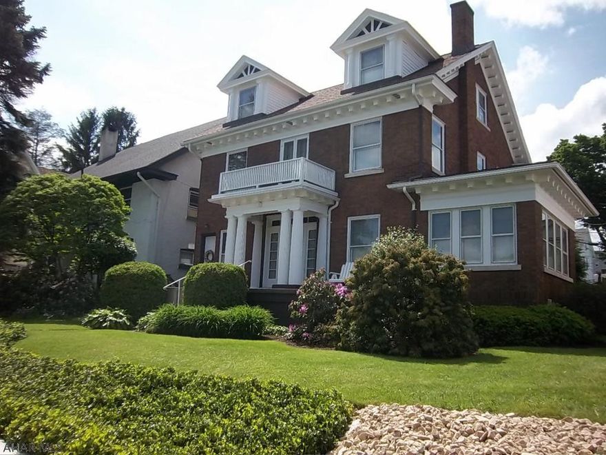 This home is a thing of beauty. . Solid brick with 3+ bedrooms and 2 full baths and two car garage..  Enjoy your morning coffee in the private courtyard. Home has lovingly been restored to it's original charm. Hardwood Floors throughout entire home.  Single/Multi family or light commercial.