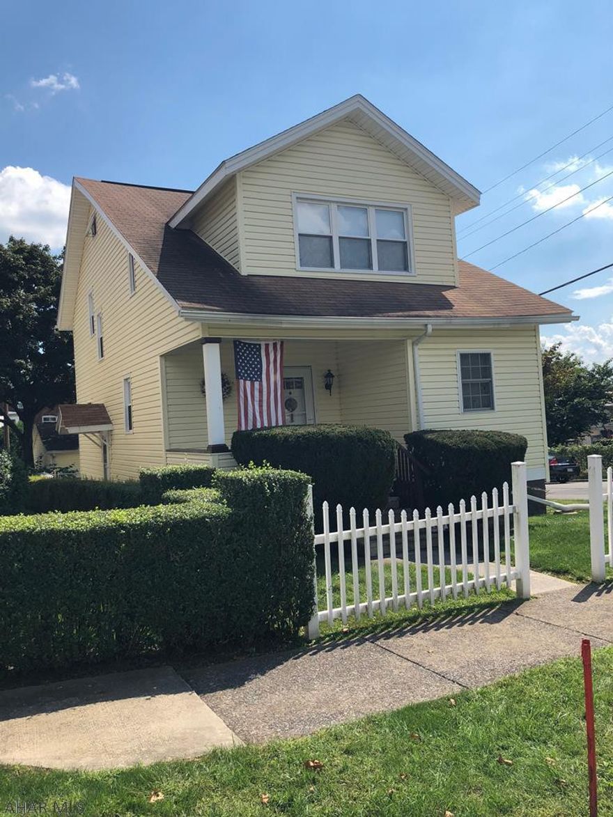 This house has Great Curb Appeal! It's the attractive corner house with a white picket fence! Bright and Homey it features: New hardwood floors, 2 bathrooms, 3 Sanyo AC units, updated kitchen, 2 car garage (also easy parking on side street), rear porch & attractive rear patio, completely fenced, newer windows. Well maintained. A must see!