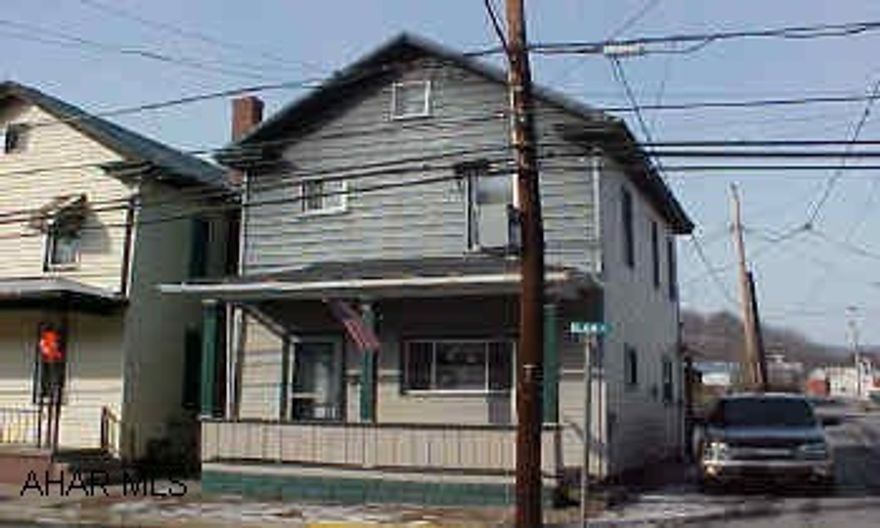 Cute starter home. Exterior vinyl and aluminum and wood - wrap around deck in rear, fenced yard.  New windows, furnace only 4 yrs old, hotwater tank 4 yrs, new counter tops in kitchen.